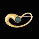 Elis Kauppi. 
14k Gold Brooch 
with 
Spectrolite - 
1956.
Designed by 
Elis Kauppi and 
crafted at ...