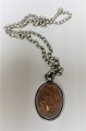 Silver pendant 
with amber. 
(925). Necklace 
included (925).