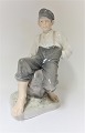 Royal 
Copenhagen. 
Sitting 
shepherd. Model 
1659. Height 31 
cm. (1 quality)