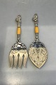 Just Andersen 
Silver Fish 
Servers(2)
Ivory Handles, 
top with 
mermaid 
decorations
Measures ...