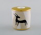 Bvlgari / Bulgari for Rosenthal. "Pascolo Rupestre" candle holder in porcelain. 
Animal motif and gold decoration. Late 20th century.

