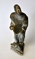 Greenlandic 
soapstone 
figure, 20th 
century. A man 
with a seal and 
drum. Signed. 
H: 13.5 ...