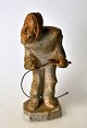 Greenlandic 
soapstone 
figure, a man 
with a whip, 
20th century. 
Unsigned. H.: 
11 cm.