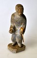 Greenlandic soapstone figure, 20th century. Standing man with hunting tools in bone. Signed. OL ...