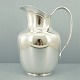 Cohr silver 
pitcher. 
Cohr; A 
pitcher of 
sterling 
silver, 
handle of 
massive silver. 
H. 19 ...