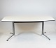 Dining table with white laminate and steel legs by Charles and Ray Eames.
5000m2 showroom.

