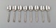 Georg Jensen Continental cutlery. Eight dessert spoons in hammered sterling 
silver.
