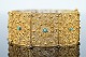 Gold filigree 
jewellery. 
A wide 
filigree 
bracelet of 18k 
gold, set with 
turquoises. L. 
19,8 ...