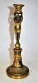 French Empire gold plated bronze candlestick, approx. 1800. Round foot with palmettes. Footpiece ...