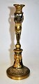 French Empire 
gold plated 
bronze 
candlestick, 
approx. 1800. 
Round foot with 
palmettes. 
Footpiece ...