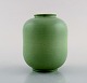 Wilhelm Kåge for Gustavsberg. Vase in glazed ceramics. Beautiful glaze in bright 
green shades. 1950