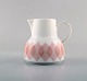 Bjørn Wiinblad for Rosenthal. "Lotus" porcelain service. Creamer decorated with 
pink lotus leaves. 1980
