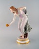 Walter Schott for Meissen. Large art nouveau porcelain figurine. "Woman with 
ball". Rare painted in pink. Ca. 1900.
