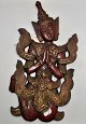 Thai painted 
wooden figure 
of praying. 
20th century. 
With gilding 
and inlaid 
stones. H.: 43 
cm. ...