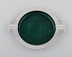Evald Nielsen (1879-1958), Denmark. Art deco cigar ashtray in sterling silver 
forged with duck motifs. Inside decorated with green enamel. Dated 1951.
