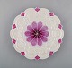 Antique Meissen plate with floral motif and purple decoration. 19th century.

