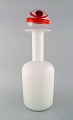 Otto Brauer for 
Holmegaard. 
Large vase / 
bottle in white 
art glass with 
ball. 1960's.
Measures: ...