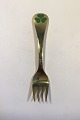 Georg Jensen 
Annual Fork 
1979  Gilded 
Sterling Silver 
with Enamel. 
14.6 cm L