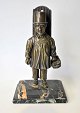 Figure of patinated bronze in the form of mann selling vegetables. ca. 1900. Germany. Figure ...