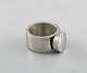 Micke Berggren, 
Sweden. 
Modernist 
designer ring 
in hammered 
pewter. Late 
20th ...