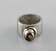 Micke Berggren, 
Sweden. 
Modernist ring 
in pewter and 
brass. Late 
20th century.
Diameter: 16.2 
...