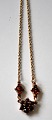 Gold plated 
chain with 
grenades, 20th 
century. 
Stamped: 
Sterling. 
Length: 46 cm.