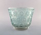 Early René Lalique. Large "Edelweiss" bowl in turquoise art glass decorated with 
flowers. Dated 1937.
