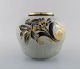 Oluf Jensen for Royal Copenhagen. Unique vase in crackled porcelain with gold 
decoration and floral motifs. Dated 1929.
