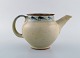 Bernard Howell Leach (1887-1979). Modernist lidded teapot in glazed stoneware. 
Typical raw 1950