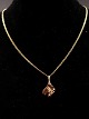 8 carat gold 
necklace 42.5 
cm. and 
pendants 1.3 x 
2.3 cm from 
silversmith 
Jens Aagaard 
...