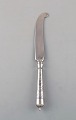 Danish 
silversmith. 
Antique knife 
in silver (830) 
with flower 
chisels. Dated 
1915-20.
Length: ...