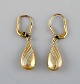 Scandinavian jeweler. A pair of 14 carat gold earrings. Mid 20th century.
