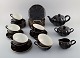 Complete Gustavsberg tea service for 10 people in porcelain. 10 cups with 
saucers and 10 plates, teapots, sugar bowl and cream jug. 1960