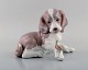 Lladro, Spain. Figure in glazed porcelain. Puppy and snail. 1980