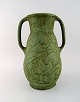 Svend Hammershøi for Kähler, Denmark. Large unique vase with handles. Sgraffito 
technique in the form of foliage. Beautiful glaze in light green shades. ca. 
1905.
