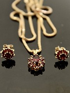 14 carat gold necklace  and pendants  with garnets and ear studs