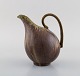Arne Bang. Jug 
with handle in 
glazed 
ceramics. Model 
number 161. 
Beautiful glaze 
in green and 
...