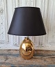 Le Klint 
egg-shaped gold 
lamp in glass 
Height 
including 
socket 30 cm. 
The price is 
without ...