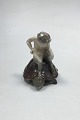 Royal 
Copenhagen 
Figurine of 
faun sitting on 
a turtle No 
1880. Measures 
13 cm / 5 1/8 
in. The ...