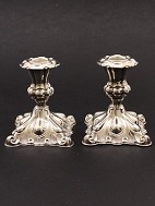 A pair of silver plated. candlesticks