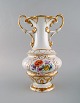 Large antique Meissen vase with handles in hand-painted porcelain with flowers 
and gold decoration. Late 19th century.
