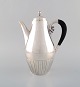 Johan Rohde for Georg Jensen. Cosmos coffee pot in sterling silver with ebony 
handle. Design 45A.

