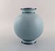 Wilhelm Kåge for Gustavsberg. Rare art deco ceramic vase decorated with silver 
inlay. Beautiful turquoise glaze. Sweden, mid-20th century.
