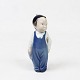 Royal 
Copenhagen 
porcelain 
figure of boy 
with a broom, 
no.: 3250.
11 x 4 cm.