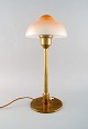 Fog & Mørup: Table lamp in brass, "Fried egg" screens in glass.
Danish design mid 20 c.