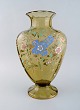Emile Gallé, 
France. Large 
antique vase in 
smoke colored 
art glass with 
flowers, 
branches and 
...