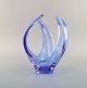Scandinavian glass artist. Vase / bowl in light blue mouth blown art glass. 
Organic form. 1960 / 70