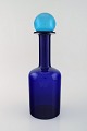 Otto Brauer for 
Holmegaard. 
Large vase / 
bottle in blue 
art glass with 
blue ball. ...