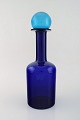 Otto Brauer for Holmegaard. Large vase / bottle in blue art glass with blue 
ball. 1960