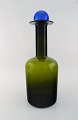 Otto Brauer for 
Holmegaard. 
Large vase / 
bottle in green 
art glass with 
blue ball. ...